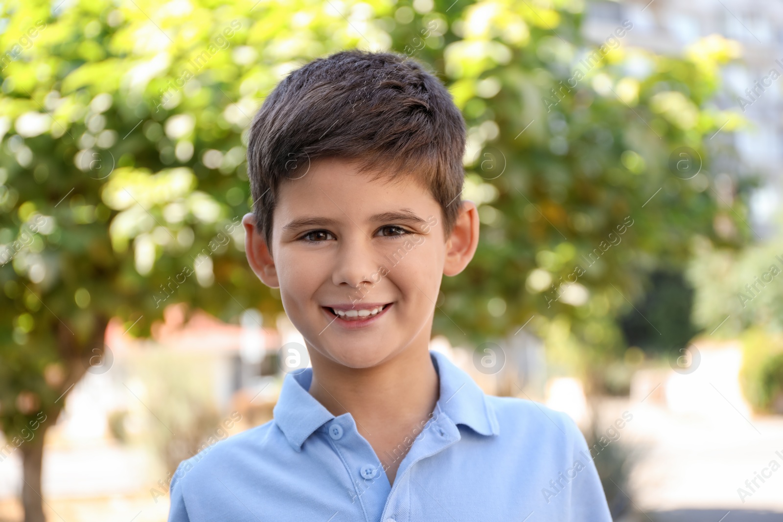 Photo of Portrait of little boy outdoors. Cute child