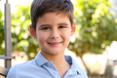 Portrait of little boy outdoors. Cute child