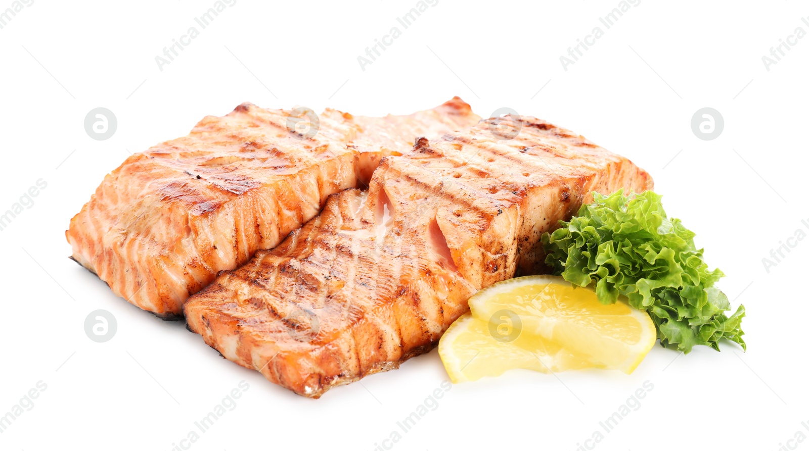 Photo of Delicious grilled salmon fillets with lemon and lettuce isolated on white