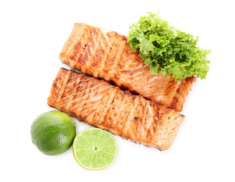 Photo of Delicious grilled salmon fillets with lime and lettuce isolated on white, top view