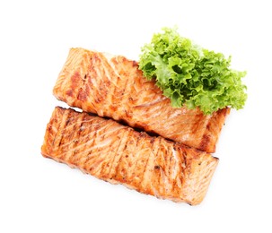 Photo of Delicious grilled salmon fillets with lettuce isolated on white, top view