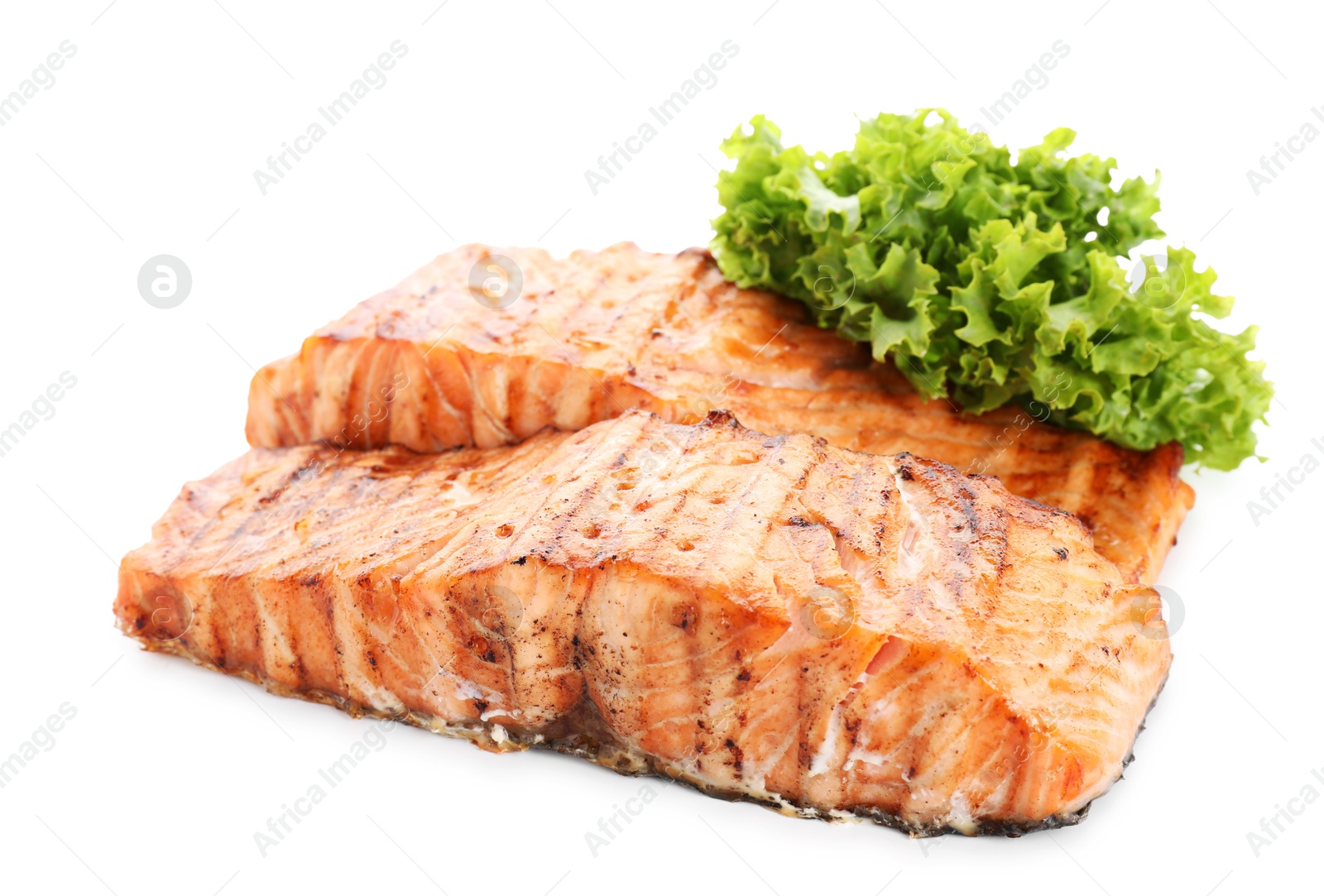 Photo of Delicious grilled salmon fillets with lettuce isolated on white