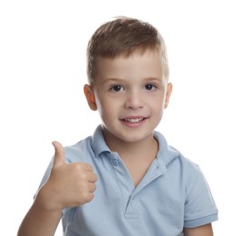 Cute little boy showing thumbs up on white background