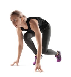 Photo of Runner in starting position on white background