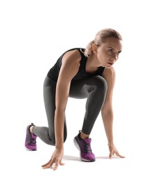 Photo of Runner in starting position on white background