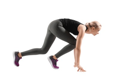 Photo of Runner in starting position on white background