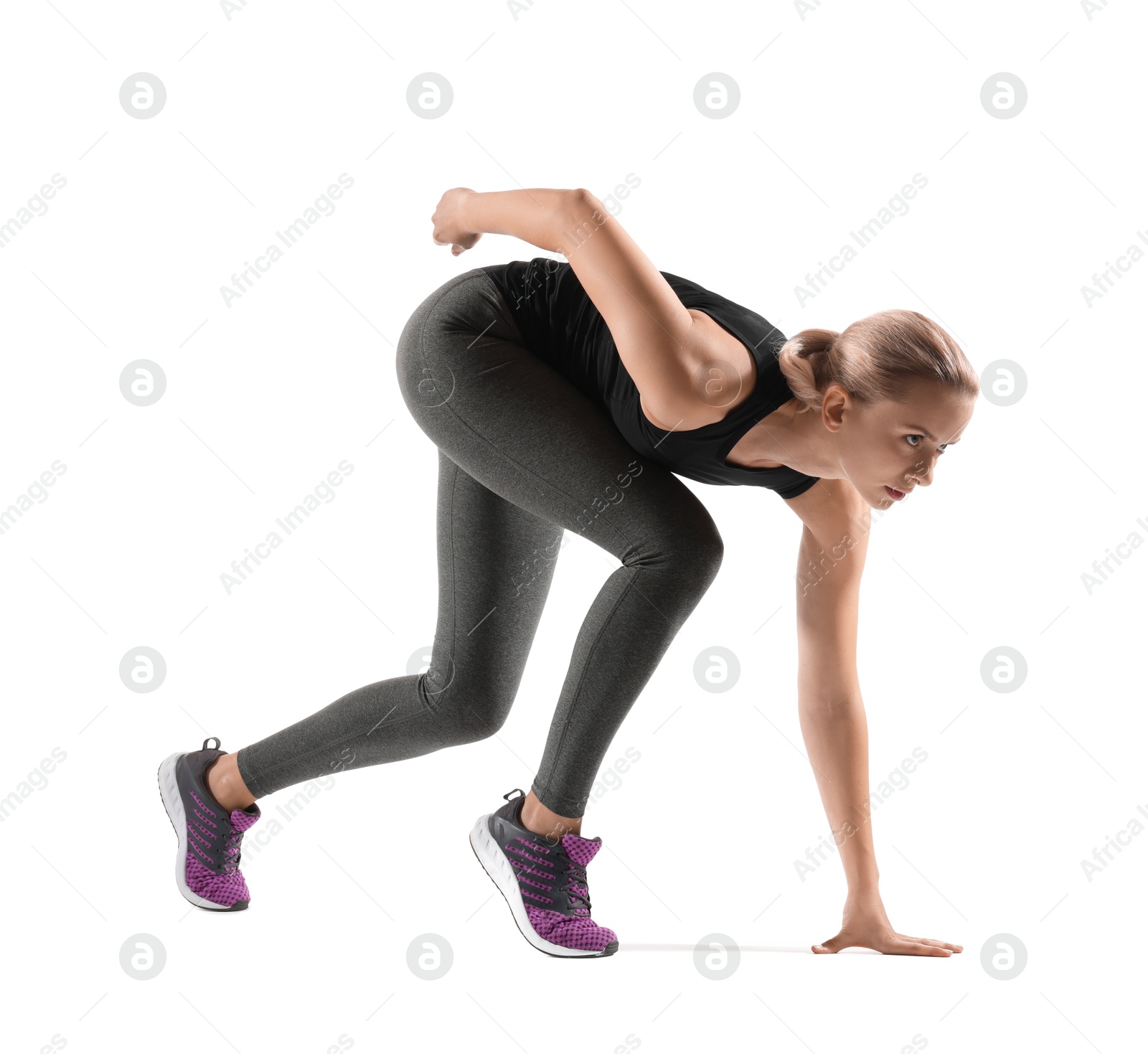 Photo of Runner in starting position on white background