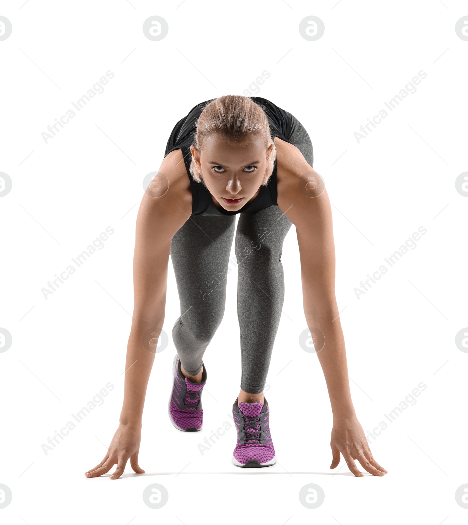 Photo of Runner in starting position on white background