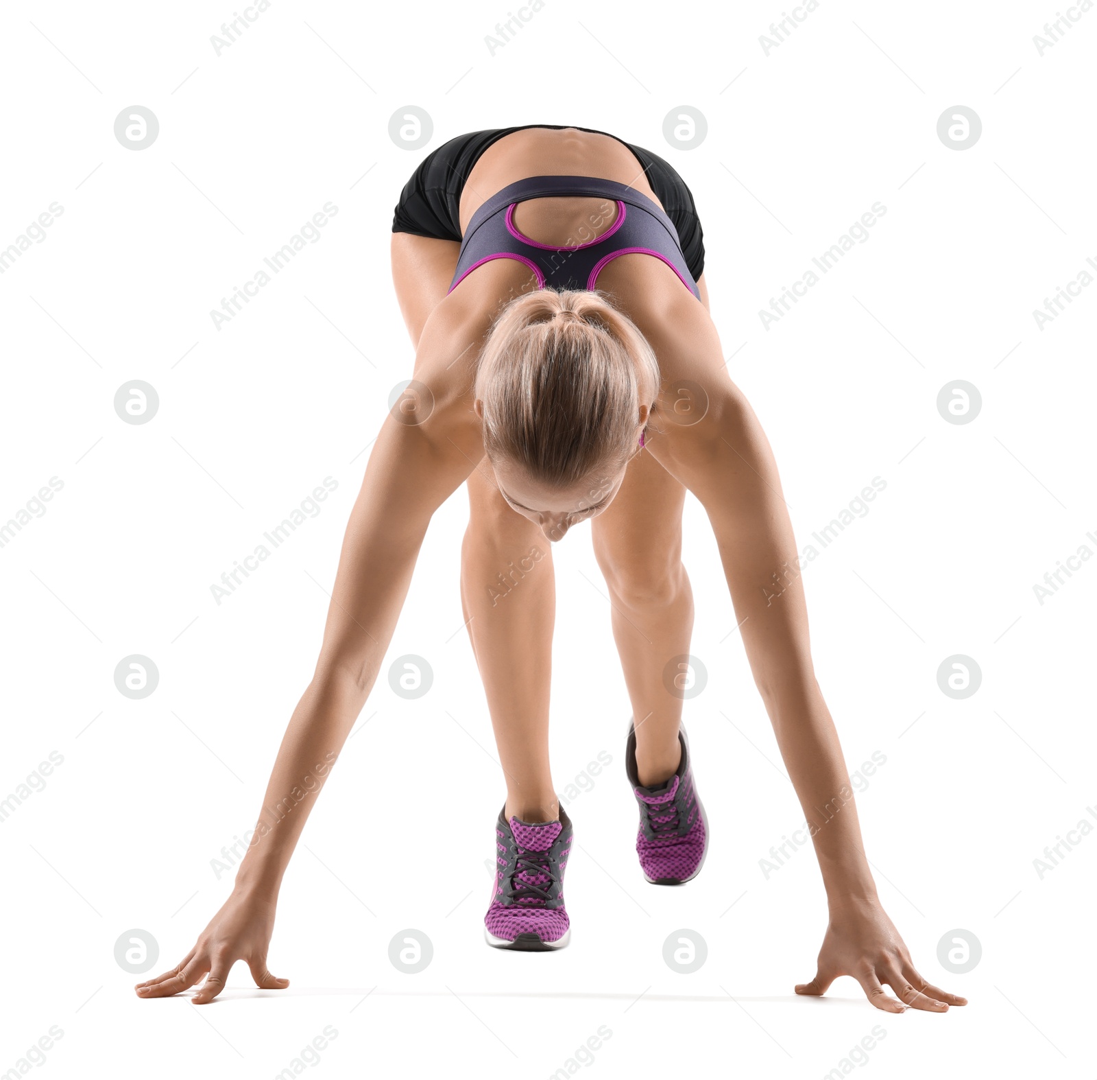 Photo of Runner in starting position on white background