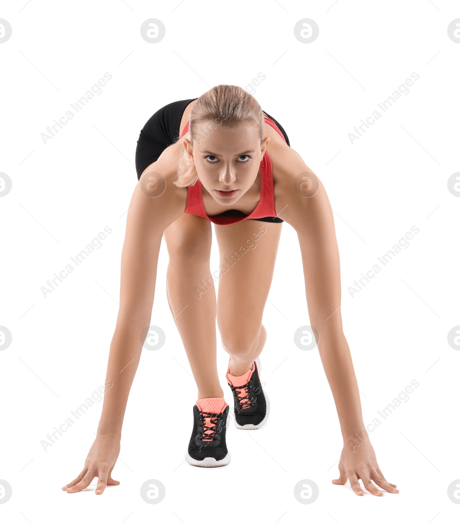 Photo of Runner in starting position on white background