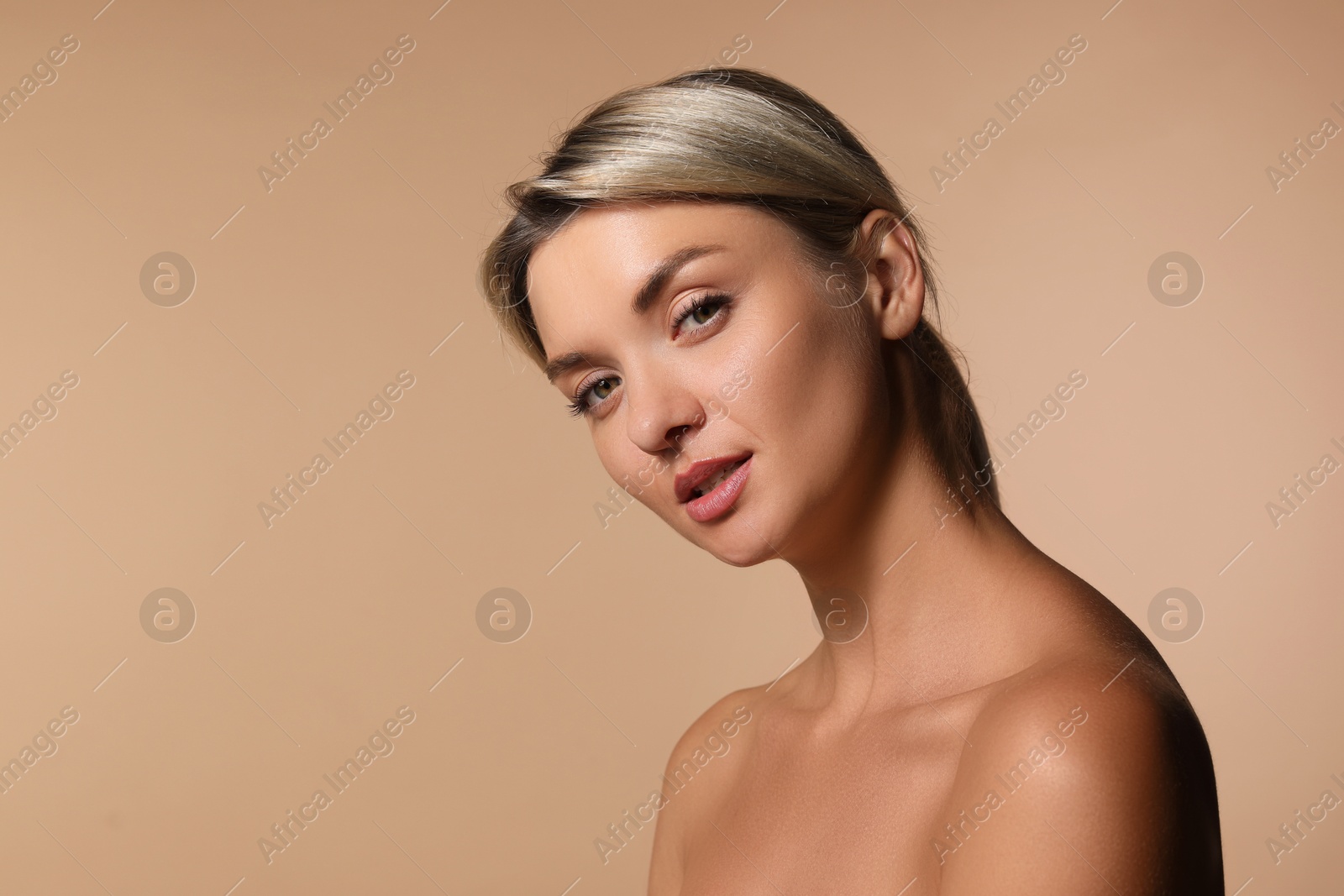 Photo of Cosmetology. Beautiful woman with perfect skin on beige background, space for text