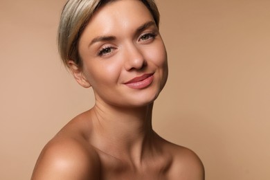 Photo of Cosmetology. Beautiful woman with perfect skin on beige background