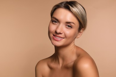 Cosmetology. Beautiful woman with perfect skin on beige background