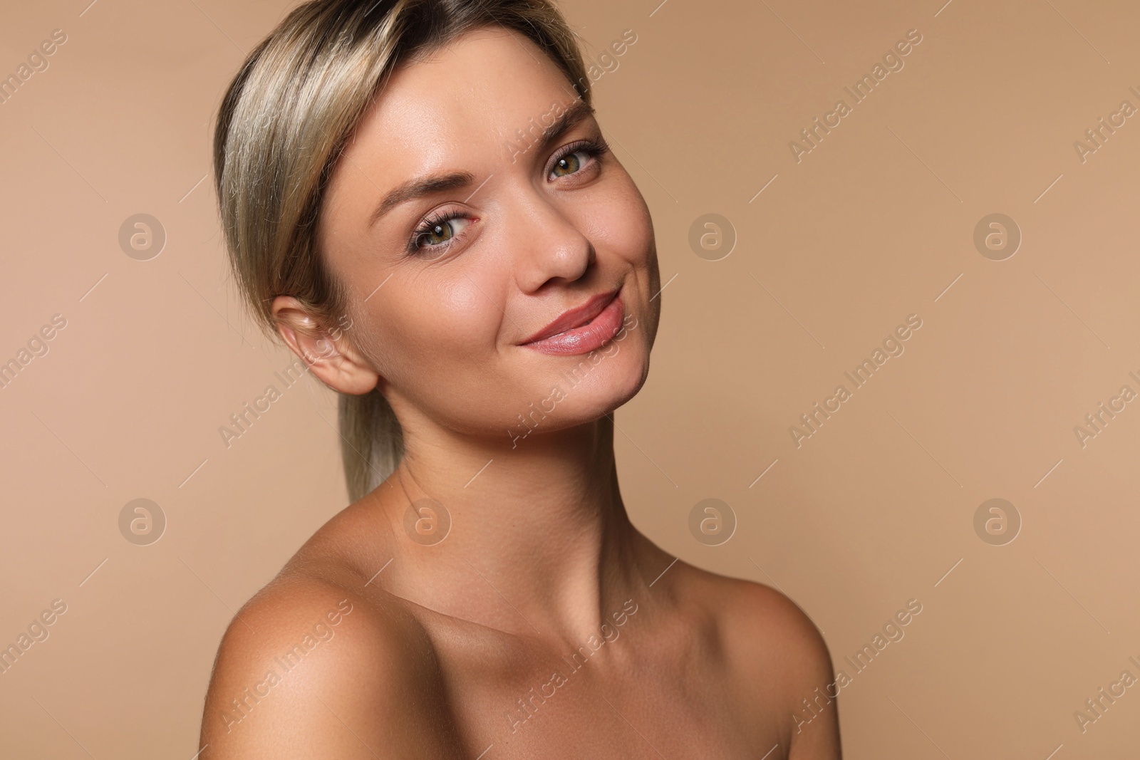 Photo of Cosmetology. Beautiful woman with perfect skin on beige background