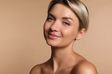 Photo of Cosmetology. Beautiful woman with perfect skin on beige background