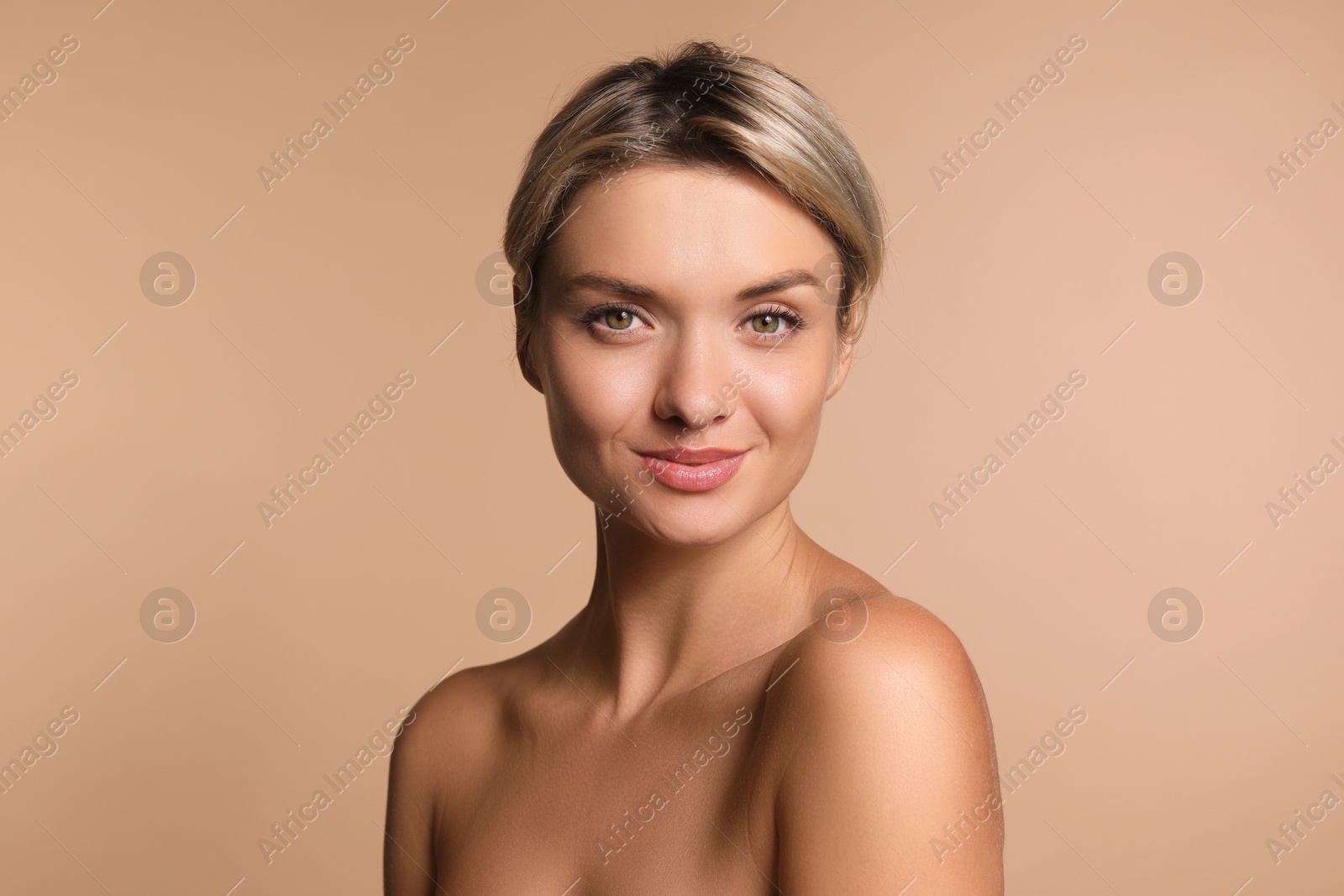 Photo of Cosmetology. Beautiful woman with perfect skin on beige background