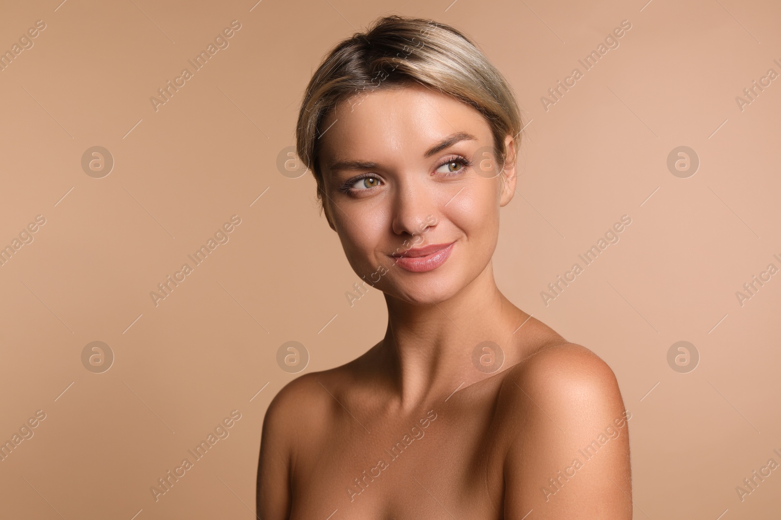 Photo of Cosmetology. Beautiful woman with perfect skin on beige background