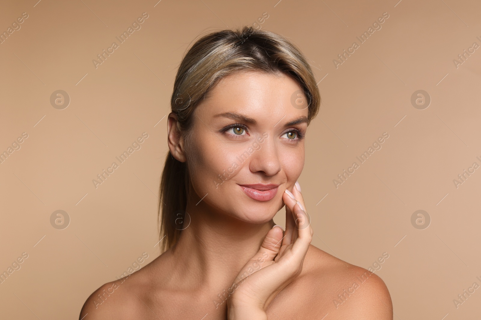 Photo of Cosmetology. Beautiful woman with perfect skin on beige background