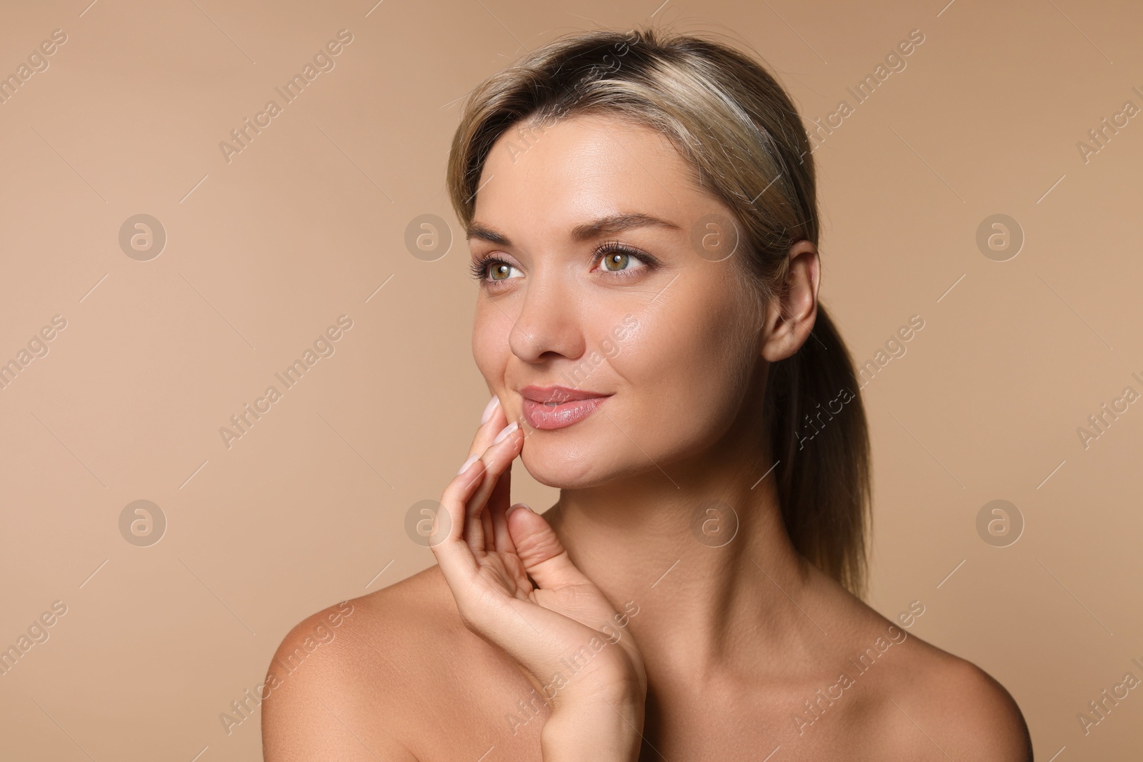 Photo of Cosmetology. Beautiful woman with perfect skin on beige background