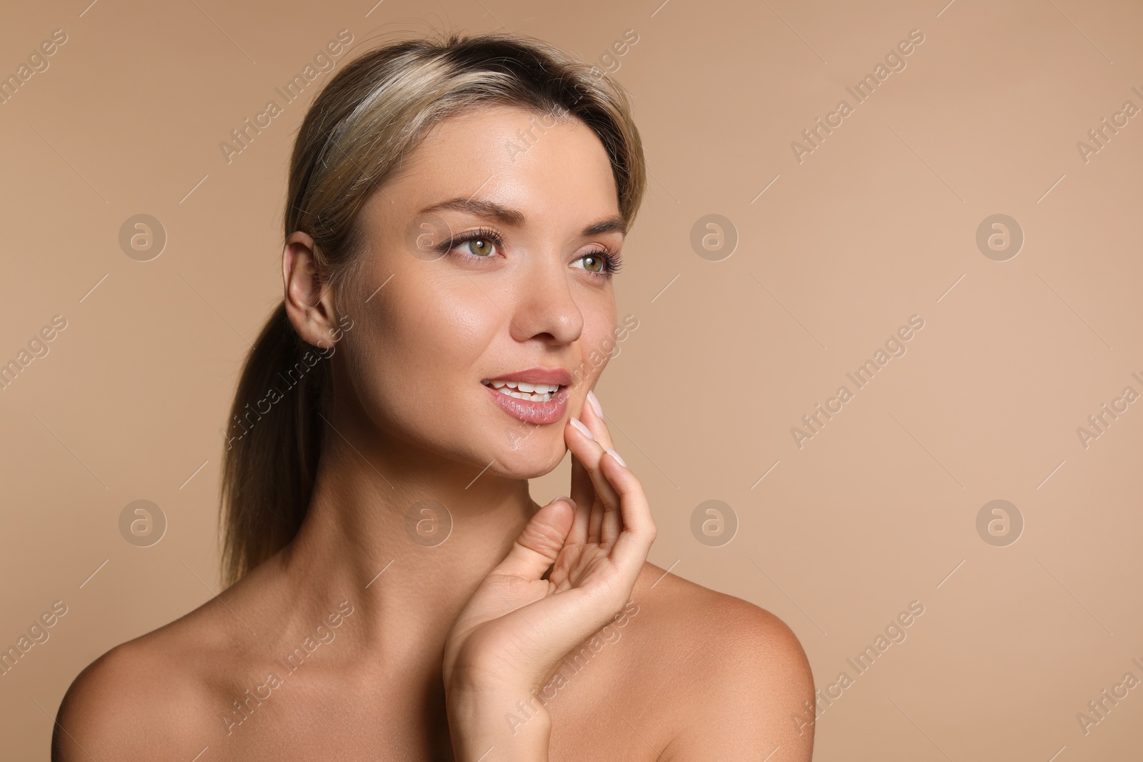 Photo of Cosmetology. Beautiful woman with perfect skin on beige background