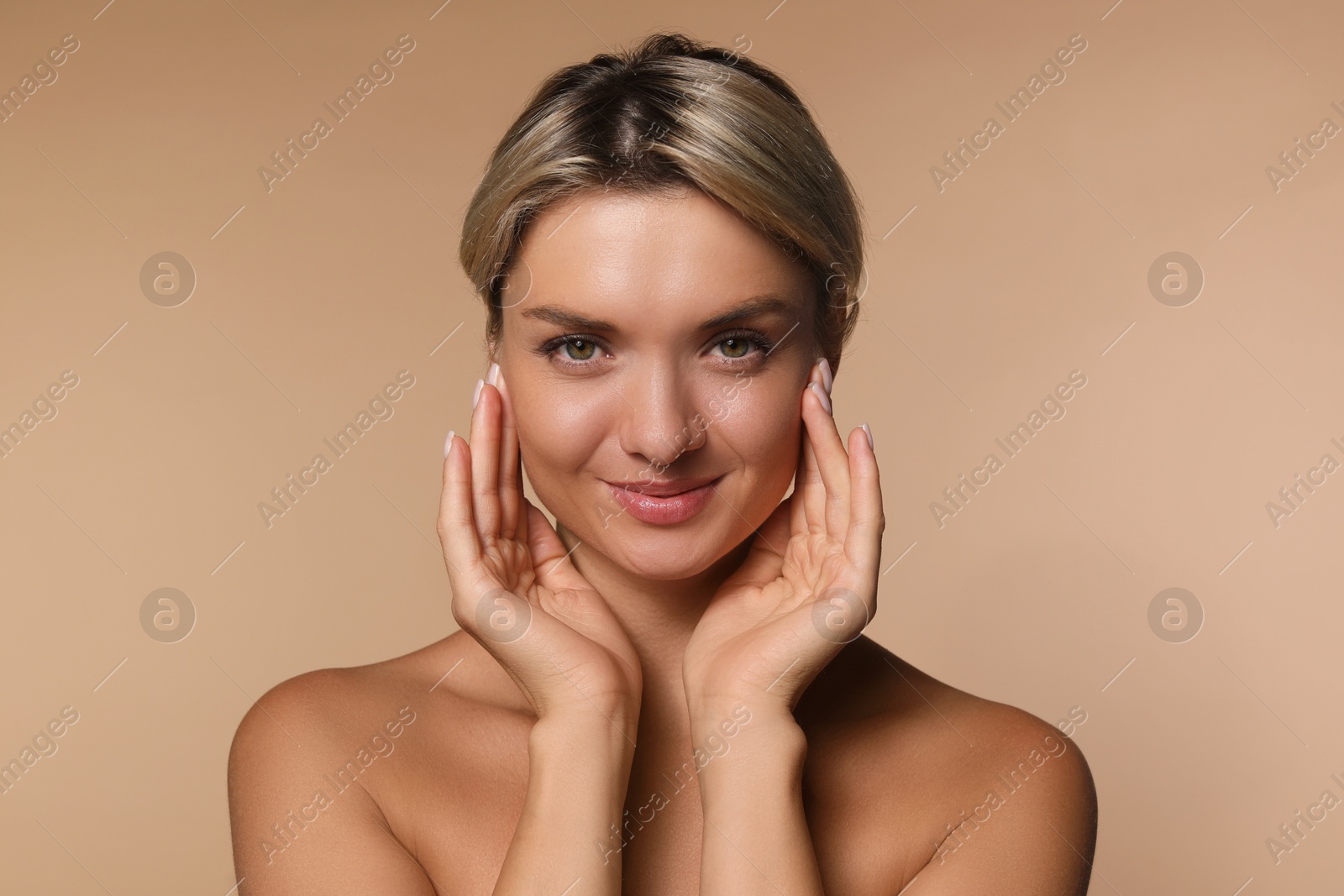 Photo of Cosmetology. Beautiful woman with perfect skin on beige background