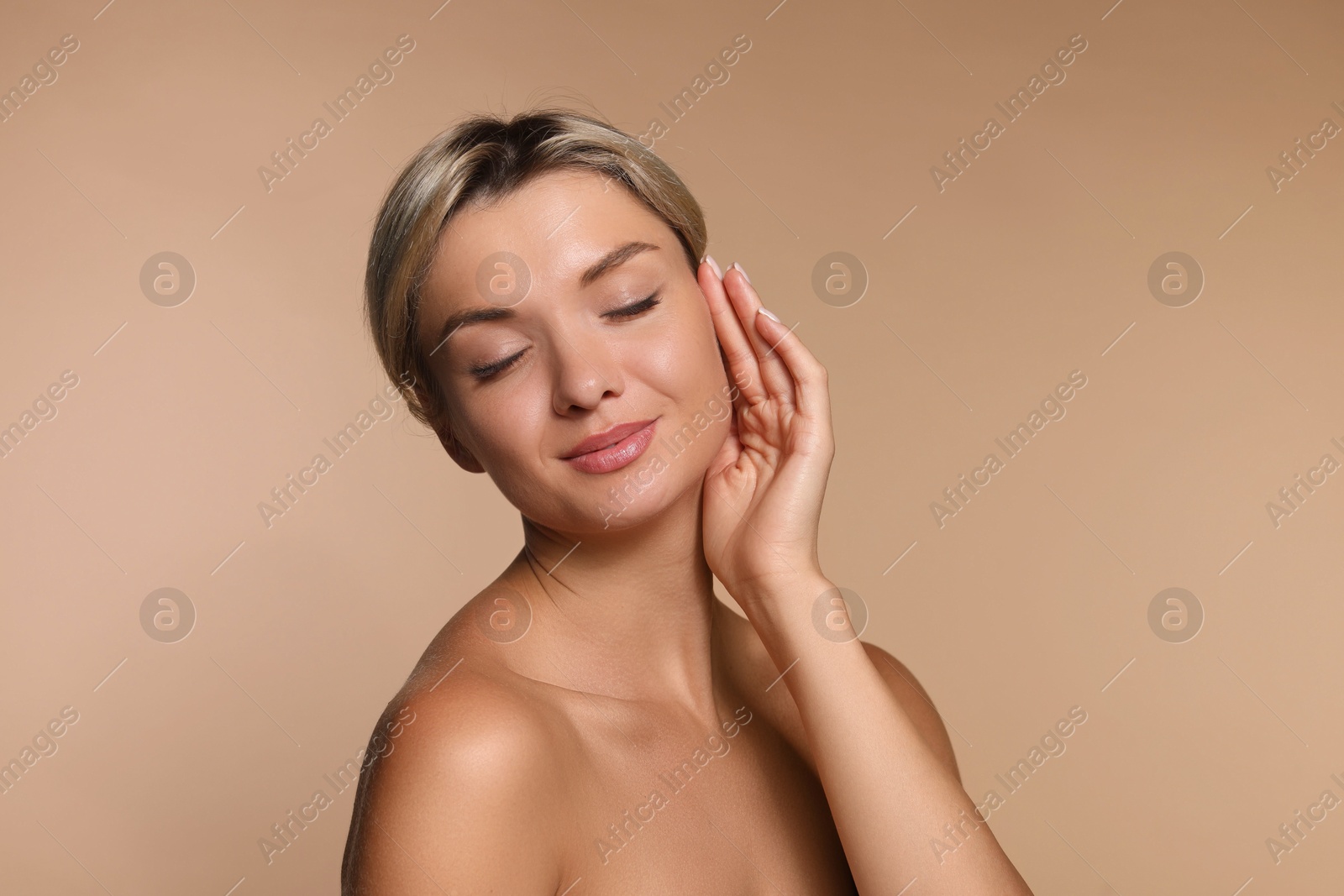 Photo of Cosmetology. Beautiful woman with perfect skin on beige background