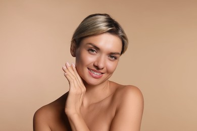 Photo of Cosmetology. Beautiful woman with perfect skin on beige background