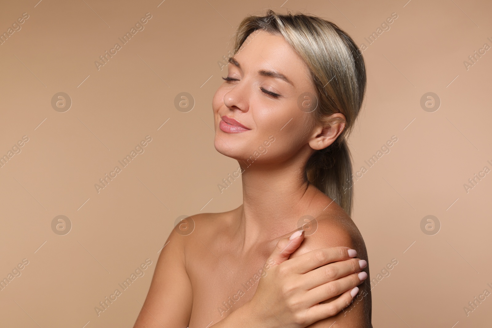 Photo of Cosmetology. Beautiful woman with perfect skin on beige background