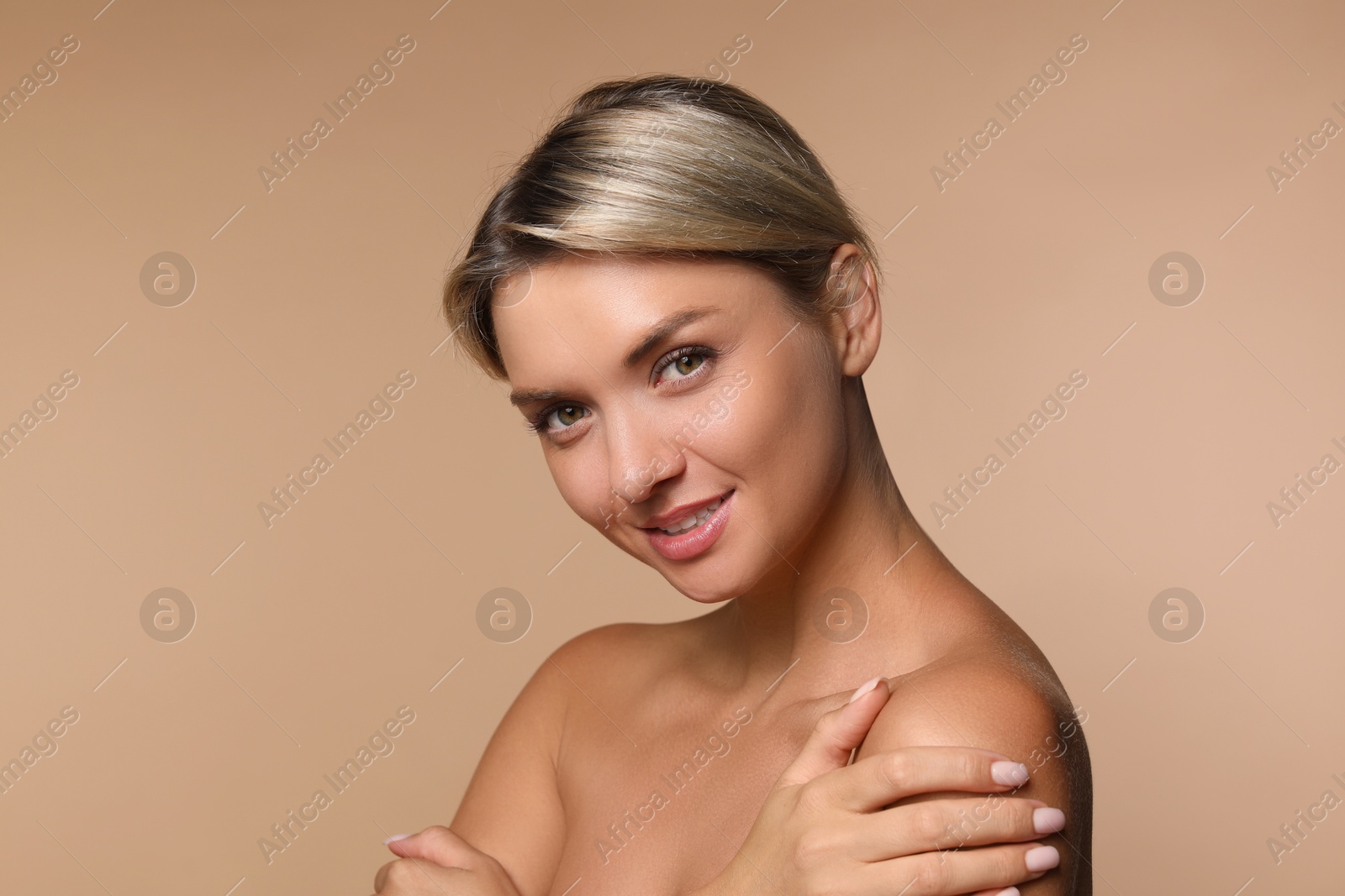 Photo of Cosmetology. Beautiful woman with perfect skin on beige background