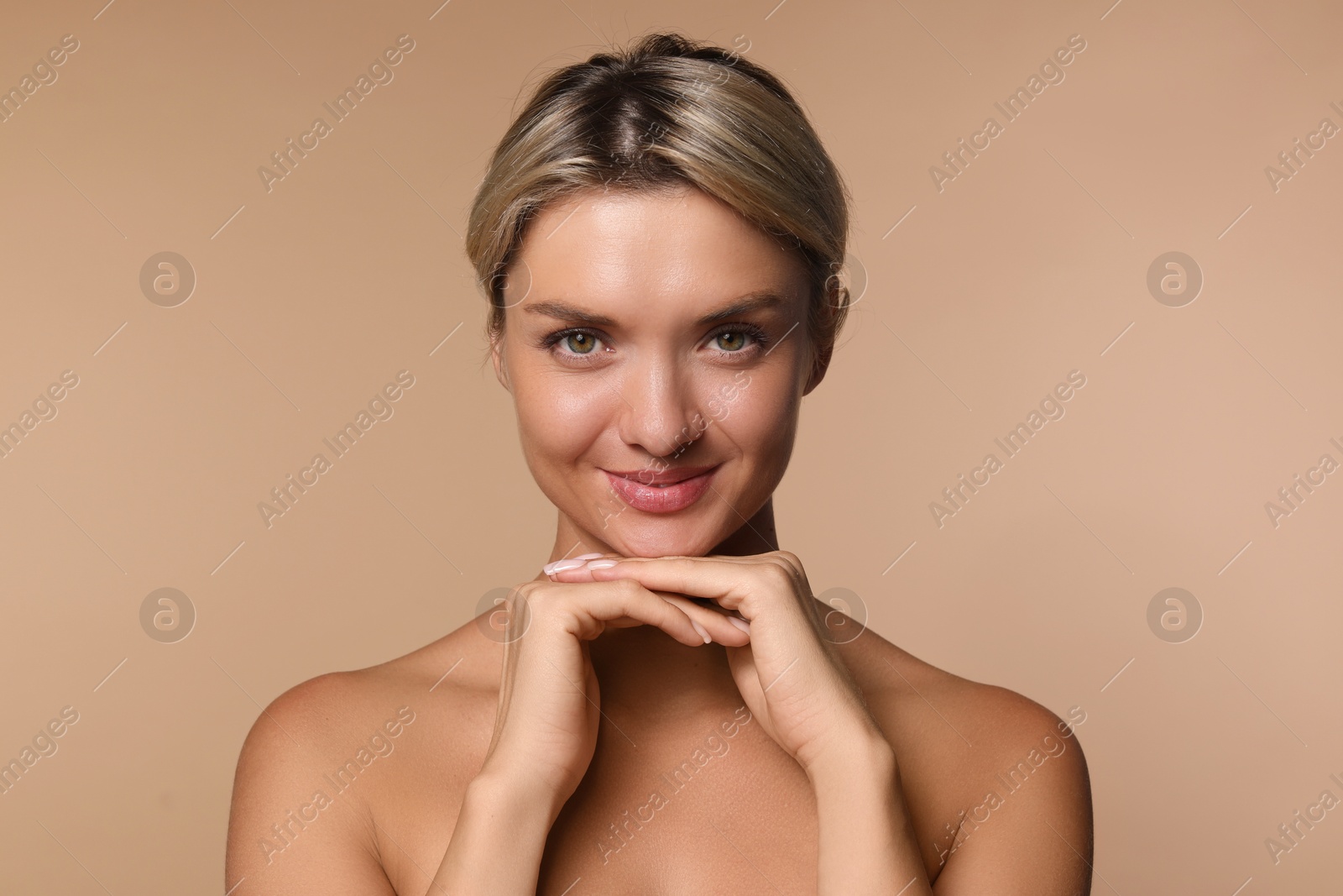 Photo of Cosmetology. Beautiful woman with perfect skin on beige background