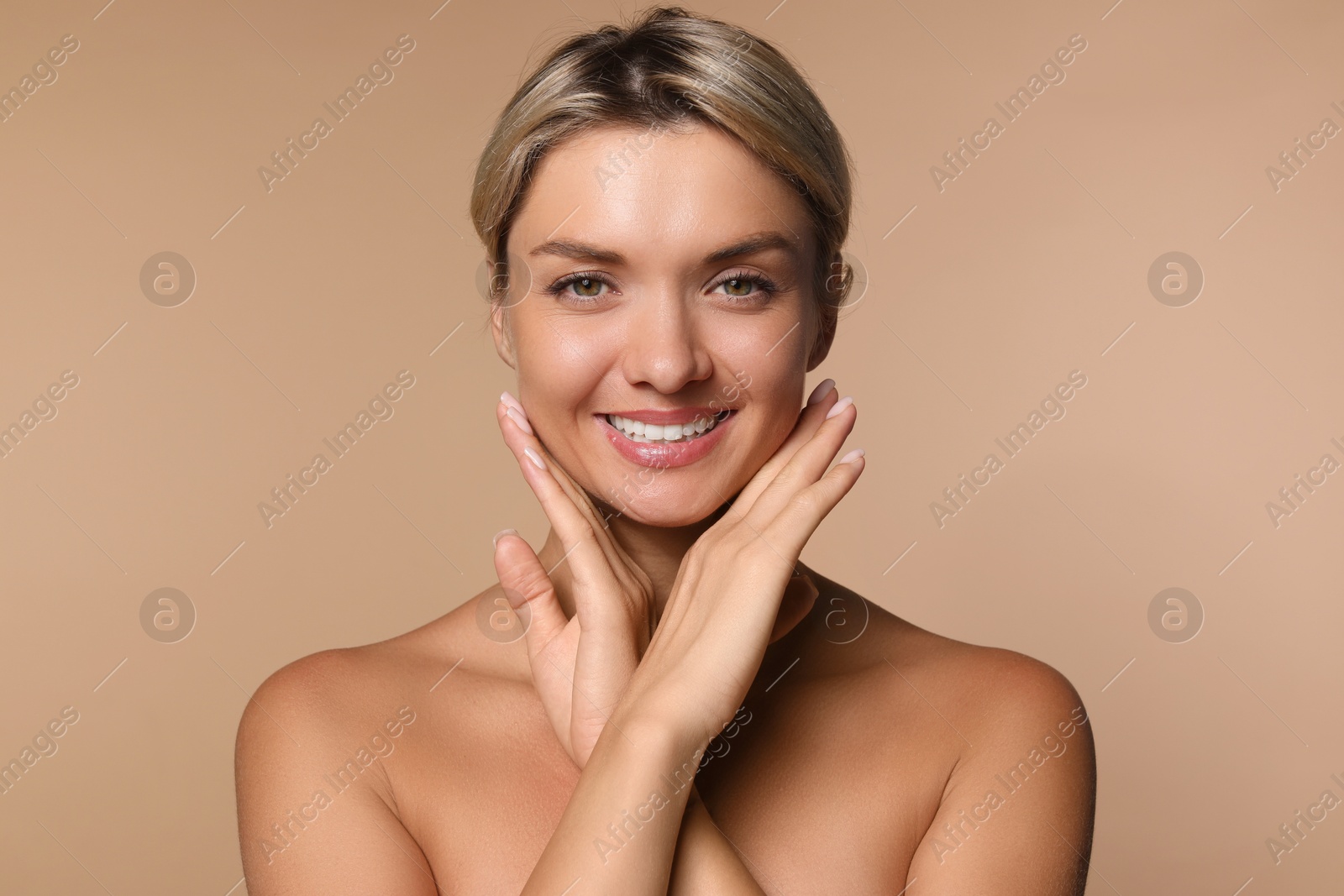 Photo of Cosmetology. Beautiful woman with perfect skin on beige background