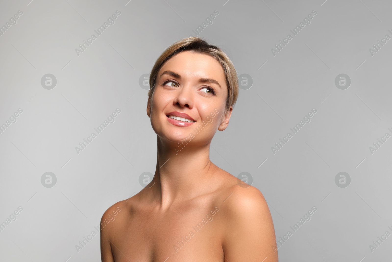 Photo of Cosmetology. Beautiful woman with perfect skin on grey background