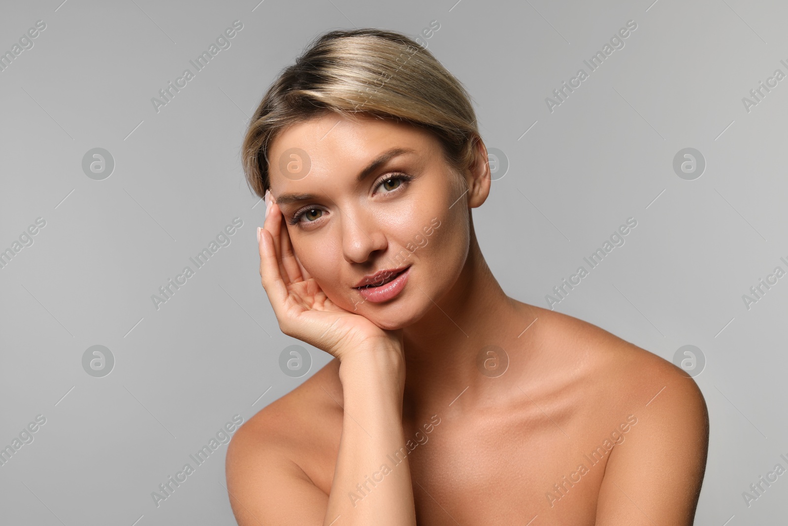 Photo of Cosmetology. Beautiful woman with perfect skin on grey background