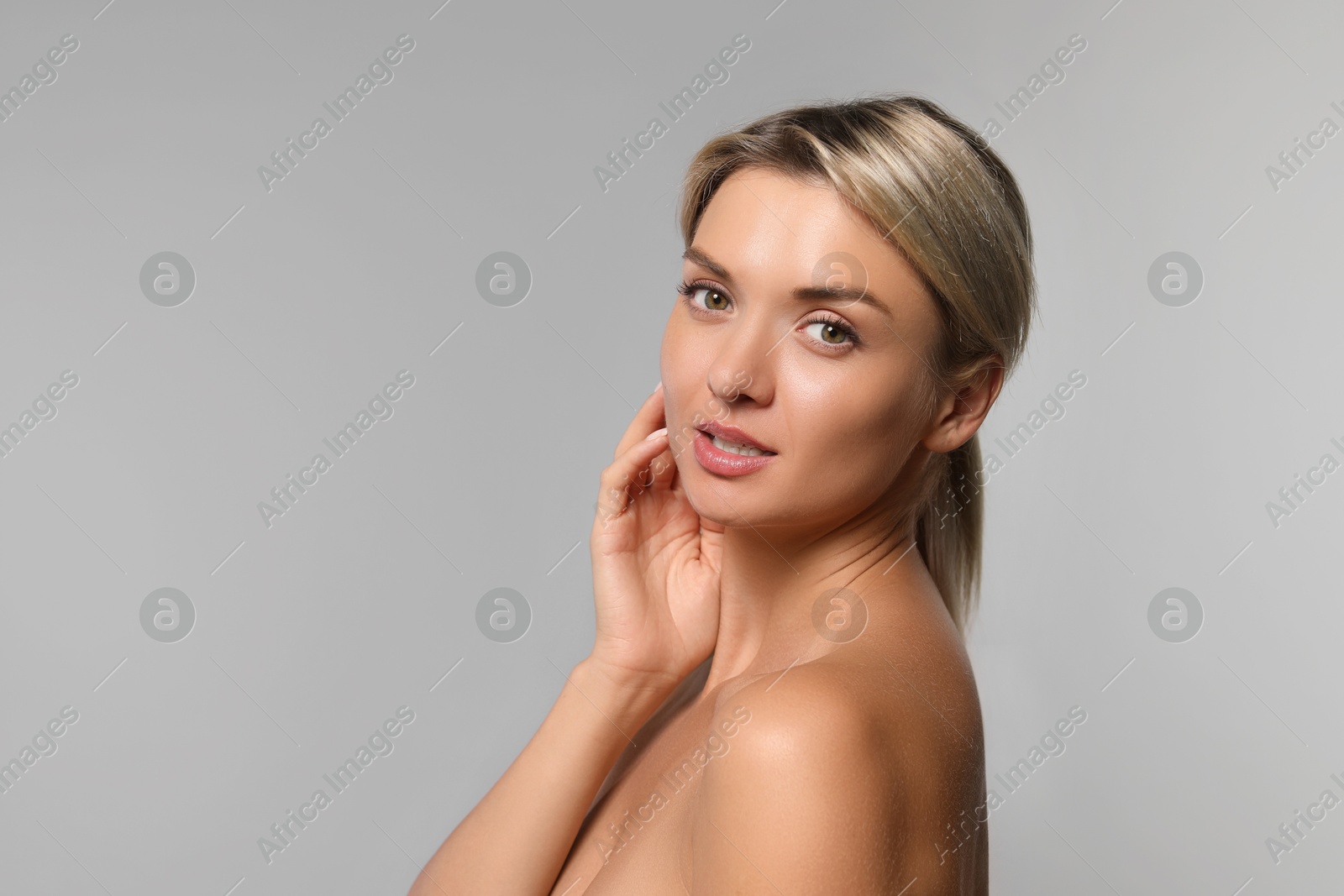 Photo of Cosmetology. Beautiful woman with perfect skin on grey background