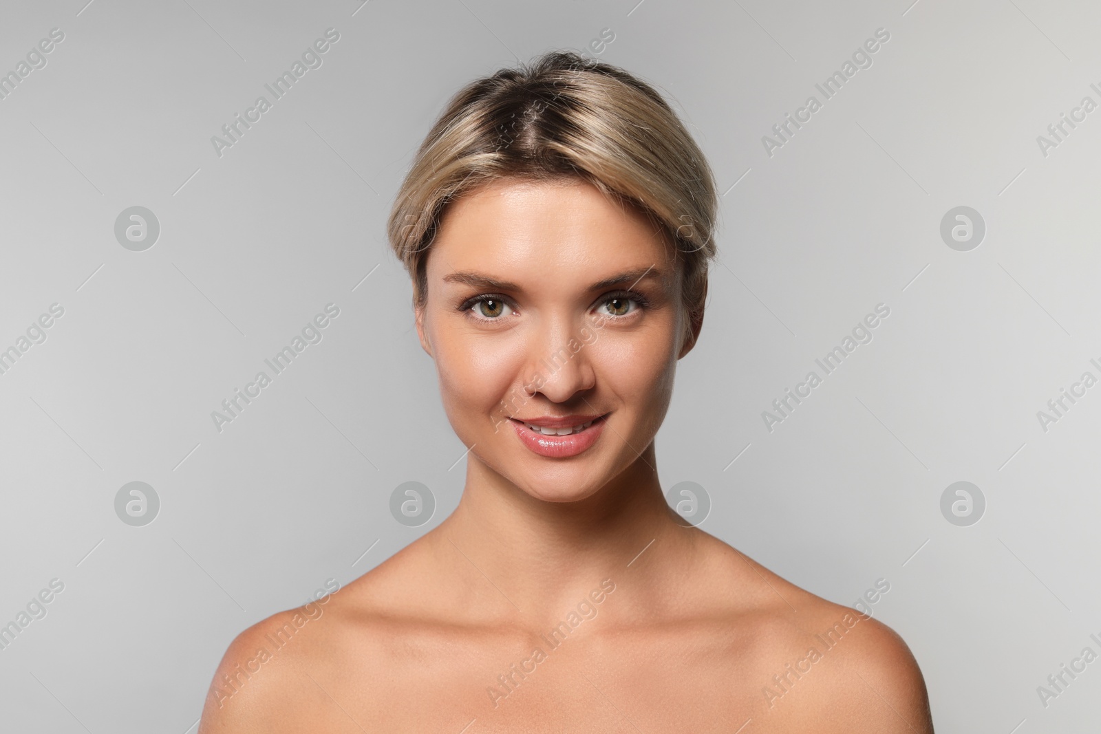 Photo of Cosmetology. Beautiful woman with perfect skin on grey background