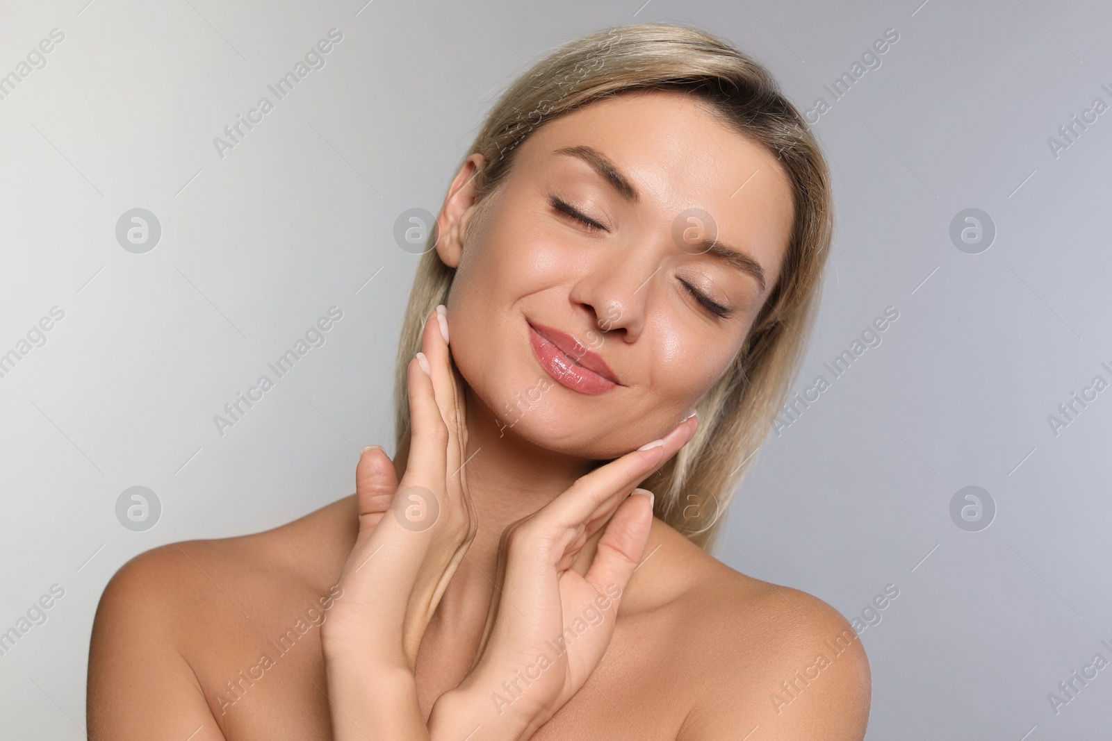 Photo of Cosmetology. Beautiful woman with perfect skin on grey background