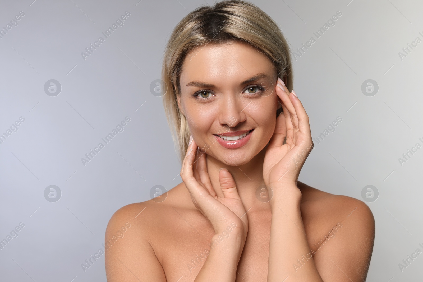 Photo of Cosmetology. Beautiful woman with perfect skin on grey background