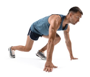 Photo of Sportsman in starting position for run on white background