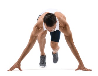 Photo of Sportsman in starting position for run on white background