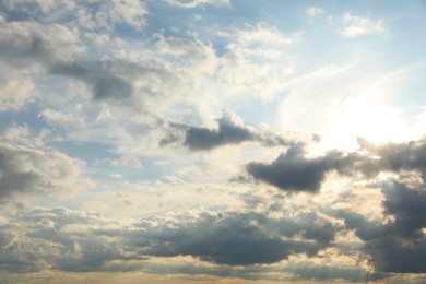 Photo of Sun shining through clouds on beautiful sky