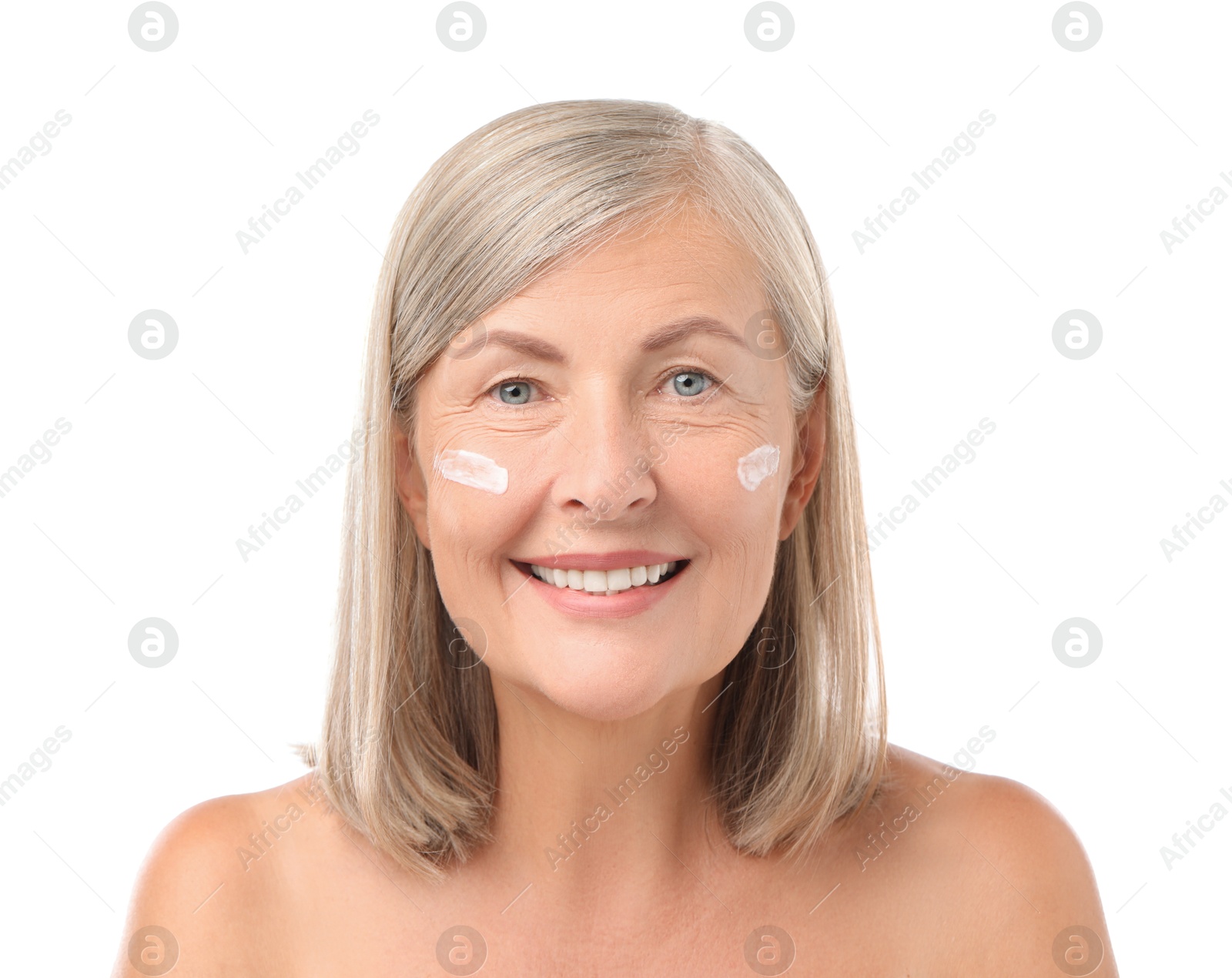 Photo of Senior woman with face cream on white background