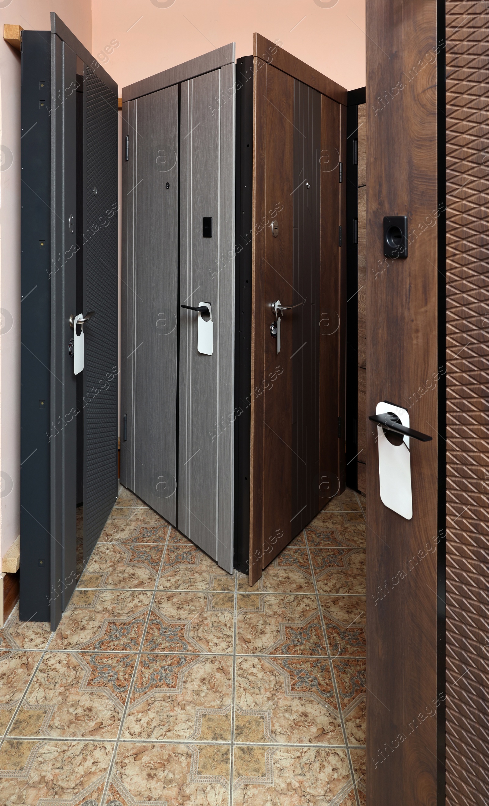 Photo of Group of different modern doors in store