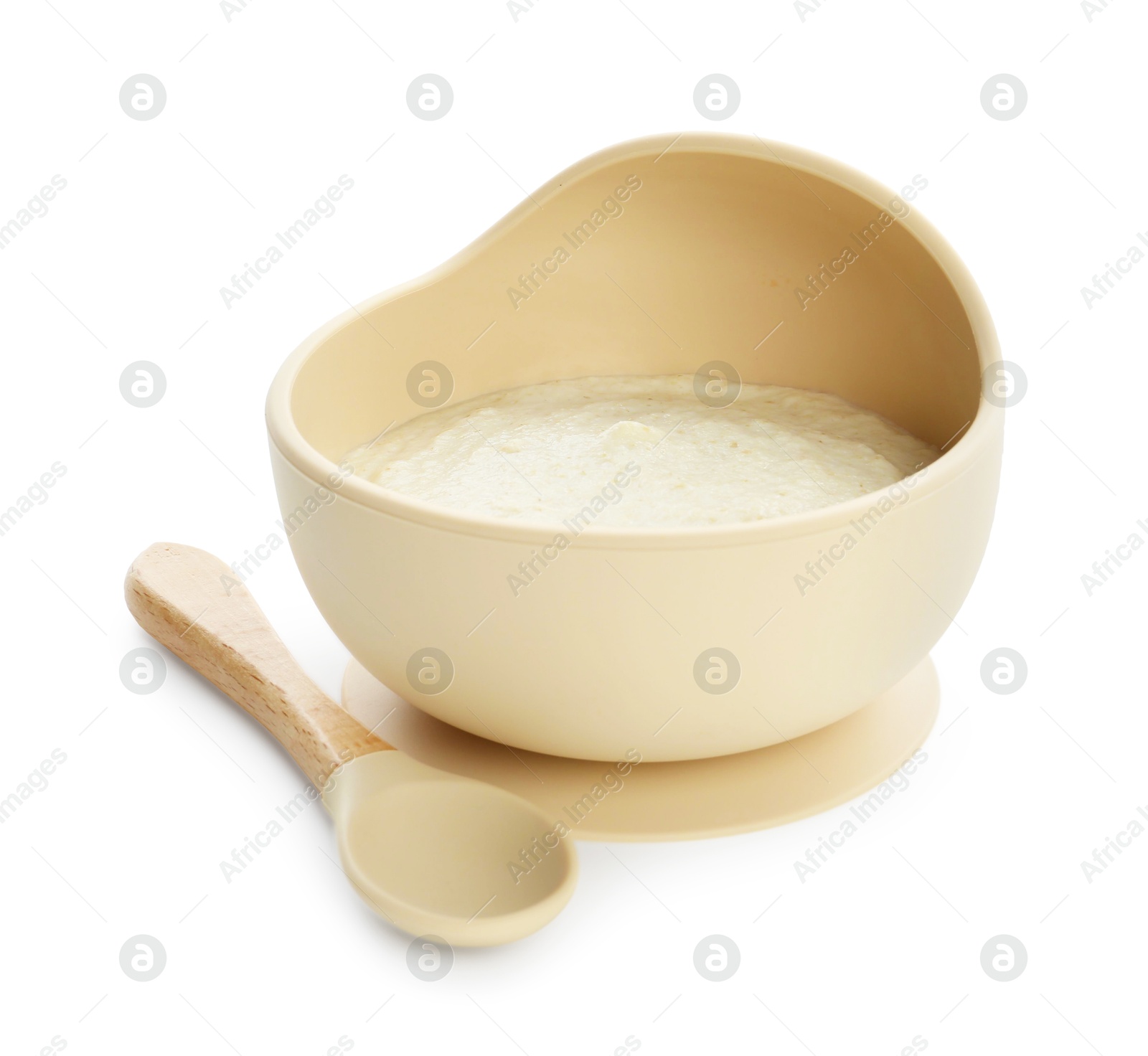 Photo of Delicious baby food in bowl and spoon isolated on white