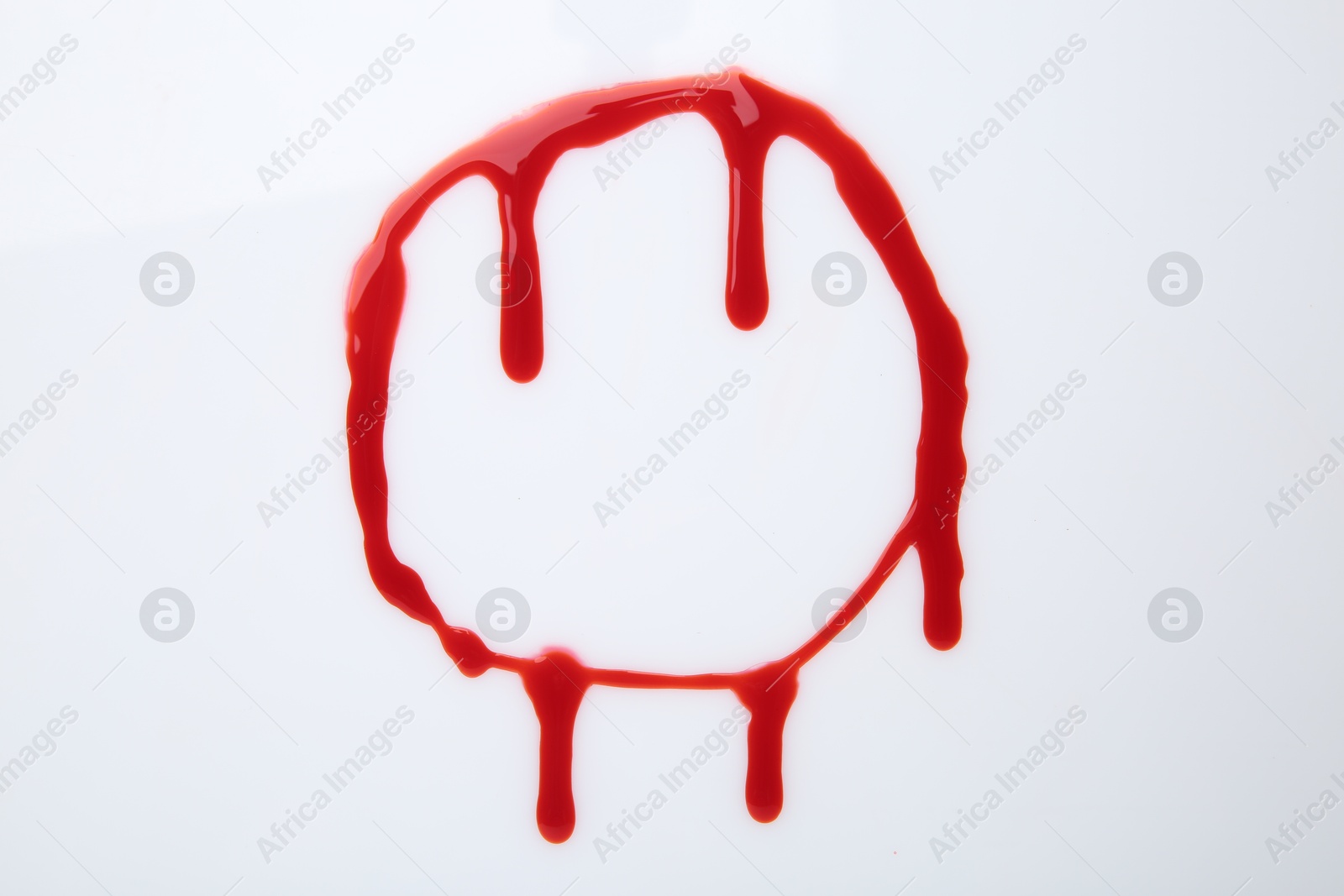 Photo of Leaking red blood stain on white background