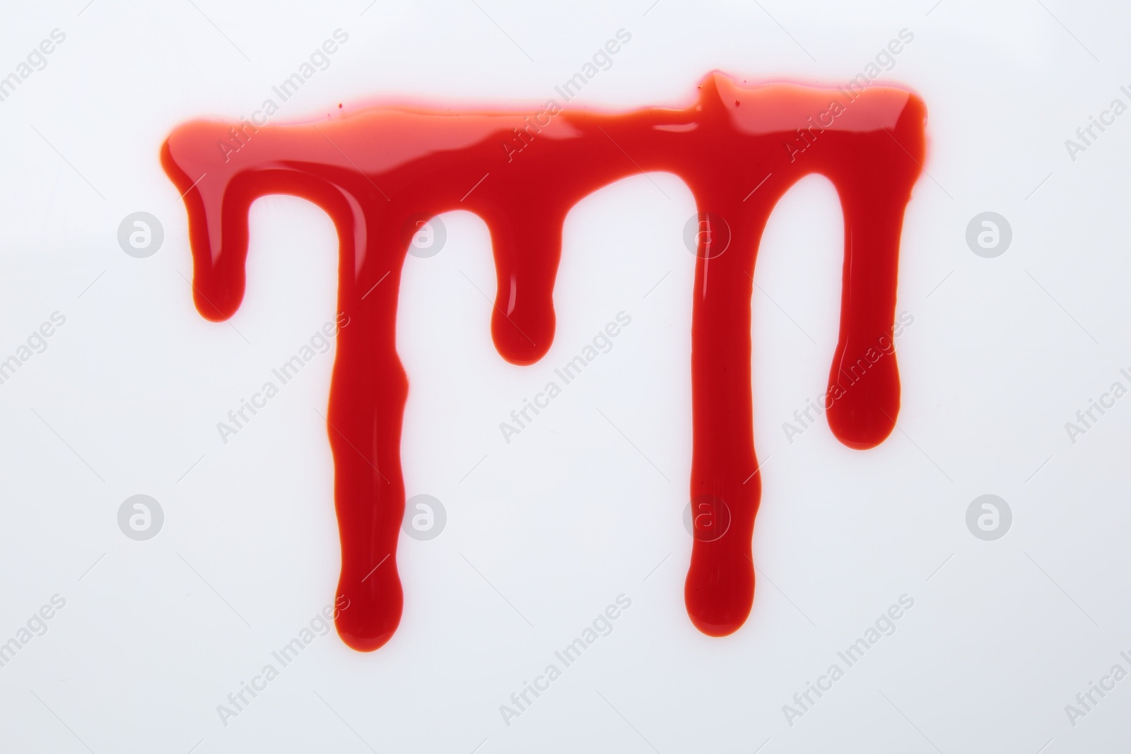 Photo of Leaking red blood stain on white background