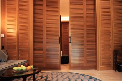 Stylish wooden sliding doors in hotel room