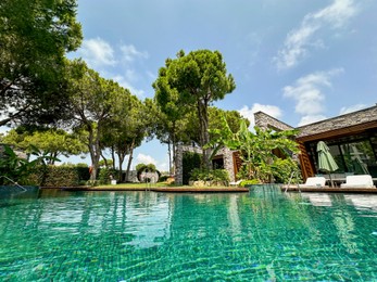 Outdoor swimming pool with clear water at luxury resort