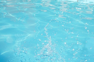 Photo of Clear water in outdoor swimming pool on sunny day