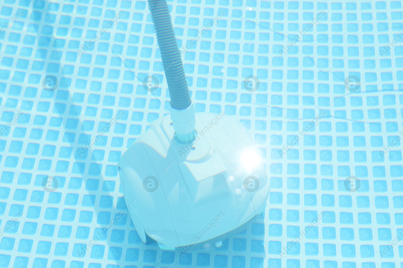 Photo of One robotic cleaner in swimming pool outdoors