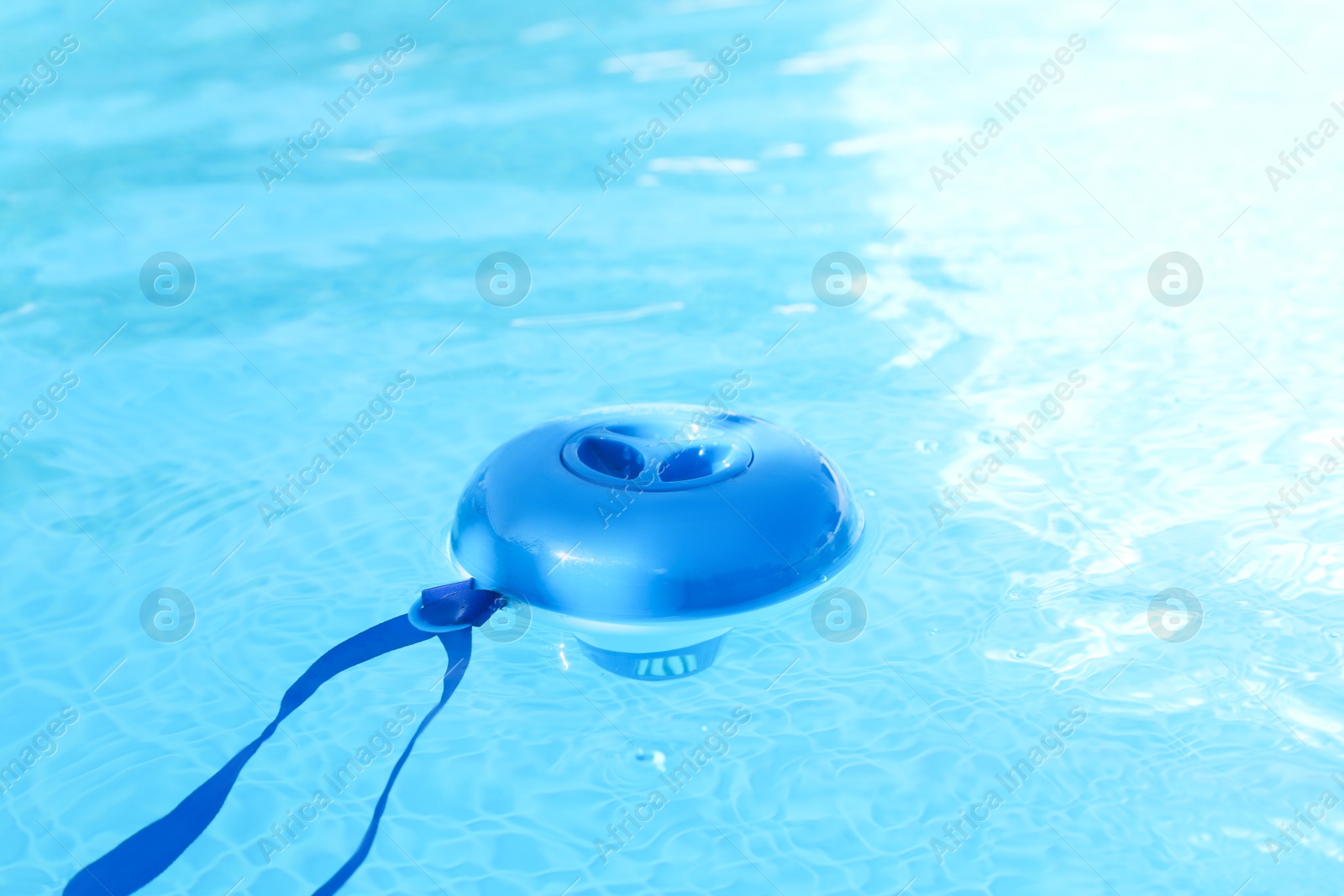 Photo of One robotic cleaner in swimming pool outdoors